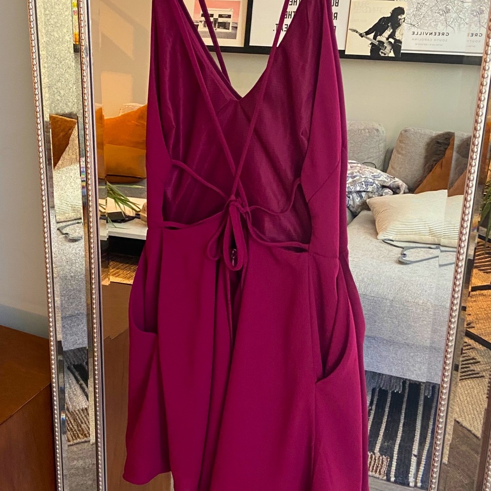 Great quality open back wine colored romper!